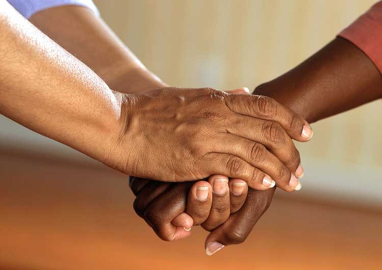 Hand holding symbolizing act of giving gift to charity 